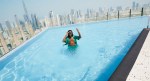 Man having fun at the rooftop pool in sls dubai