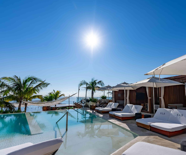 Infinity pool overlooking the beach and water.
