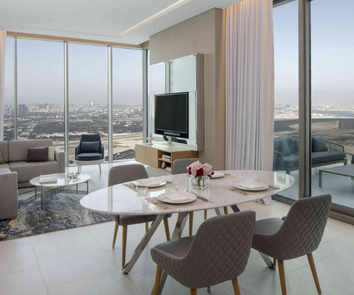 Luxurious modern apartment living and dining area with elegant decor and stylish furniture.