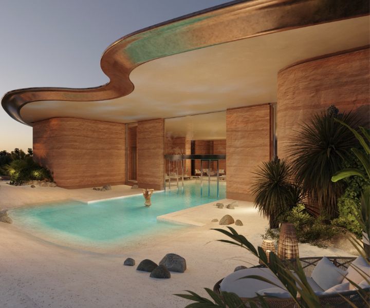 Image d’un bâtiment moderne avec une piscine intérieure/extérieure. 