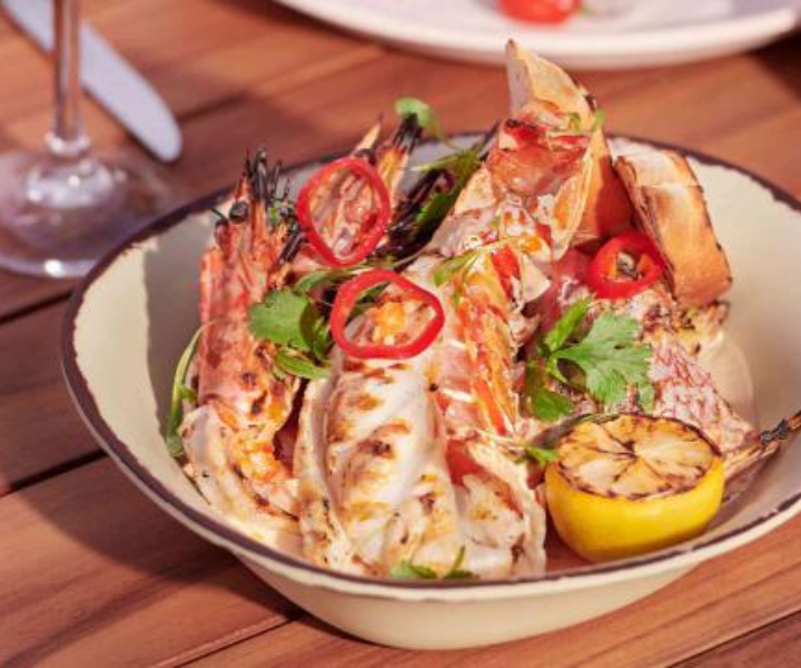 a fresh lobster dish with peppers and lemon