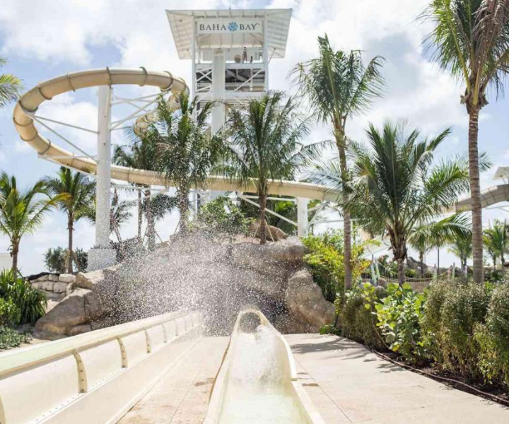 a splash from a the exit of a thrilling waterslide
