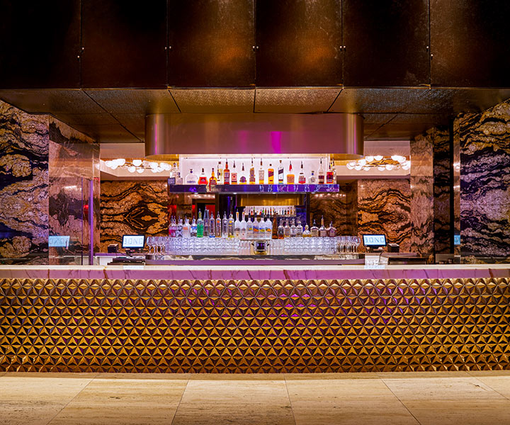 luxurious and glamorous bar with array of alcoholic drinks on display