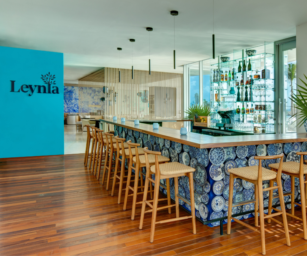 a beautiful bar with blue artistic tiles in front of Leynia 