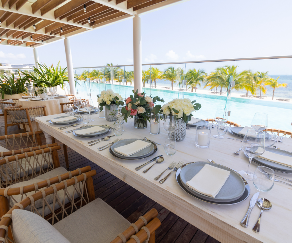 outdoor seating at leynia with views of the beach