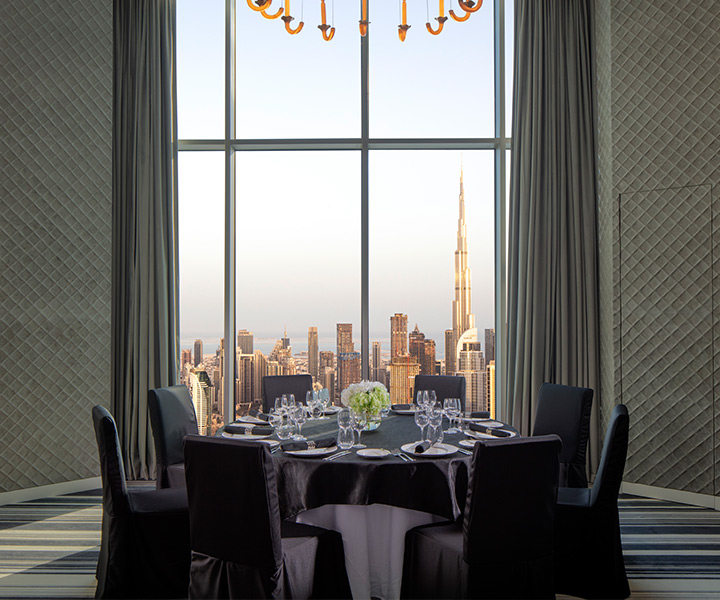 Luxurious dining room overlooking the city skyline.