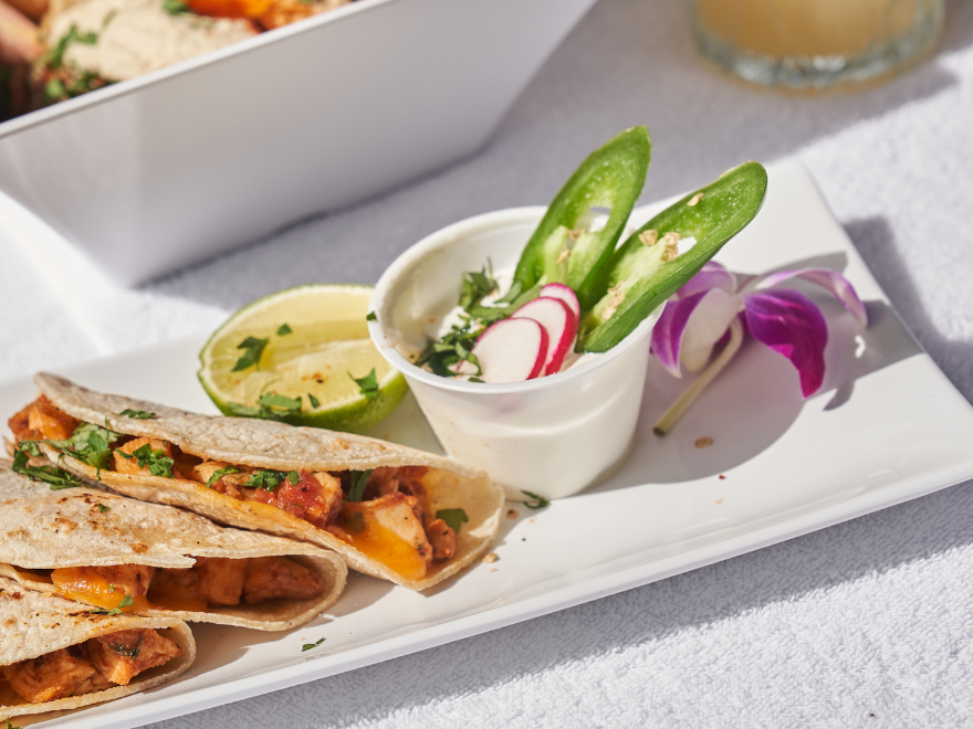 colorful quesadillas with jalapenos and onions on the side
