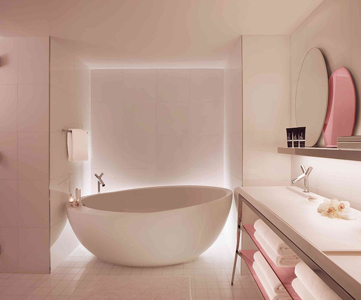 Luxurious bathroom with elegant bathtub and stylish sink.