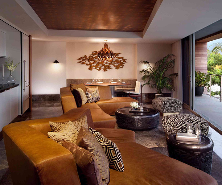 A lavish living room adorned with a grand couch and an exquisite coffee table.