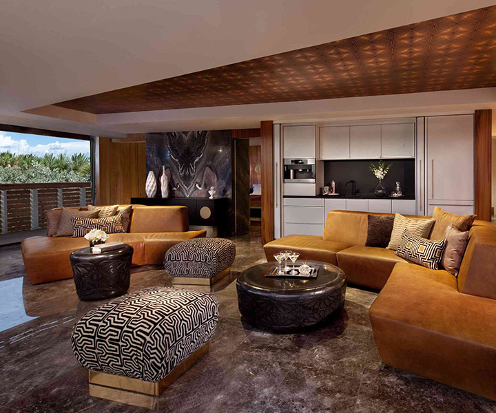 Exquisite living room adorned with a plush couch, elegant ottoman, and a sleek coffee table.
