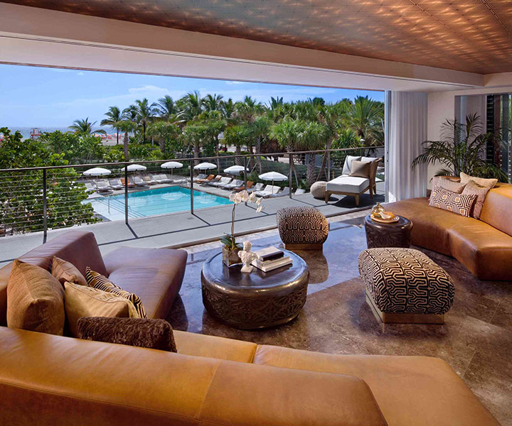 Luxurious living room with a stunning pool view.