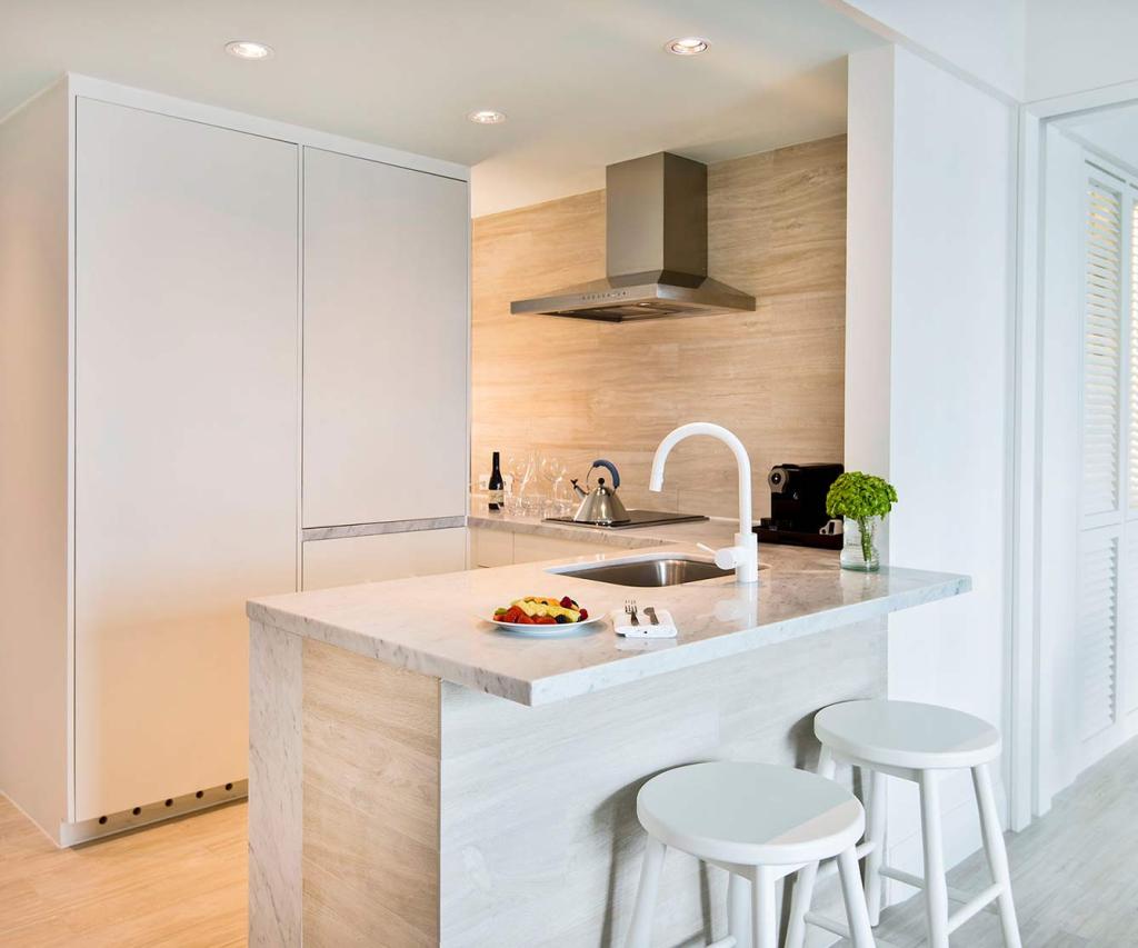 Modern kitchen with light and bright interior and a breakfast bar with stools