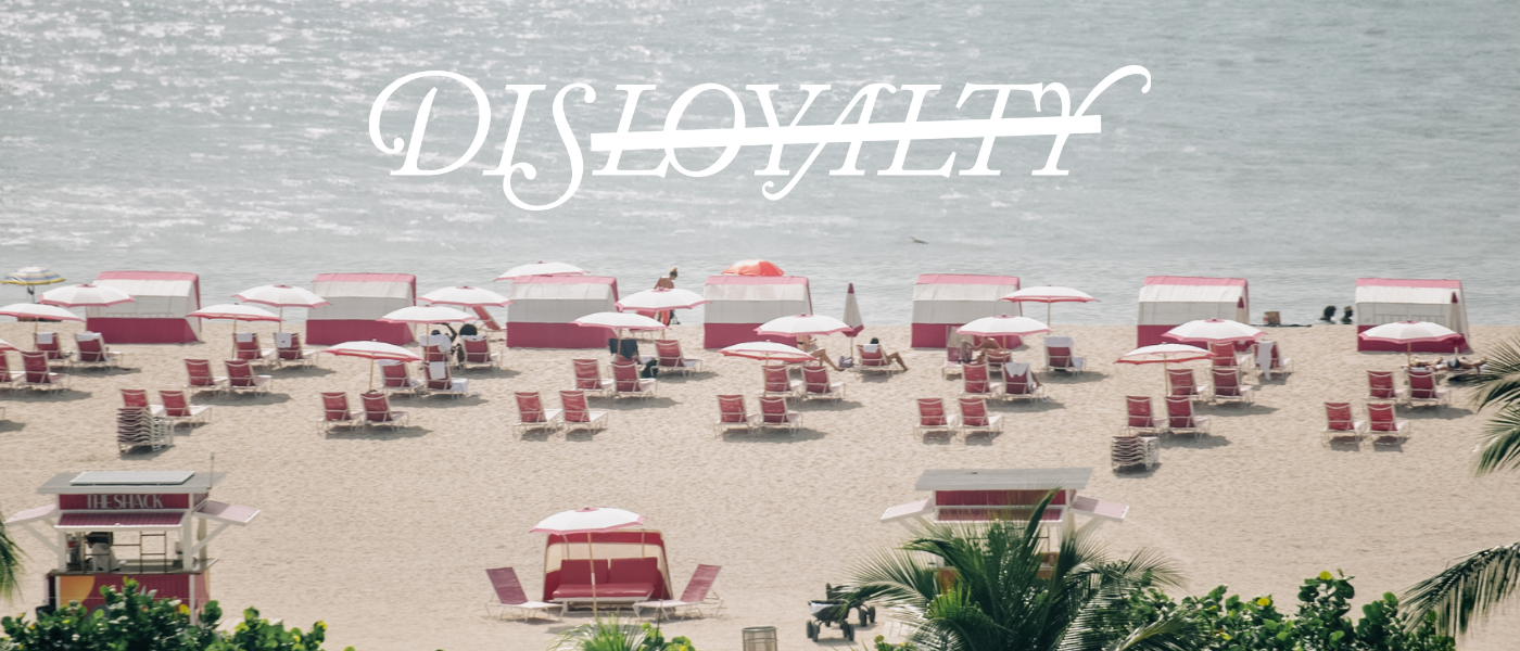 a serene beach lined with pink and white umbrellas with the logo of disloyalty over the image