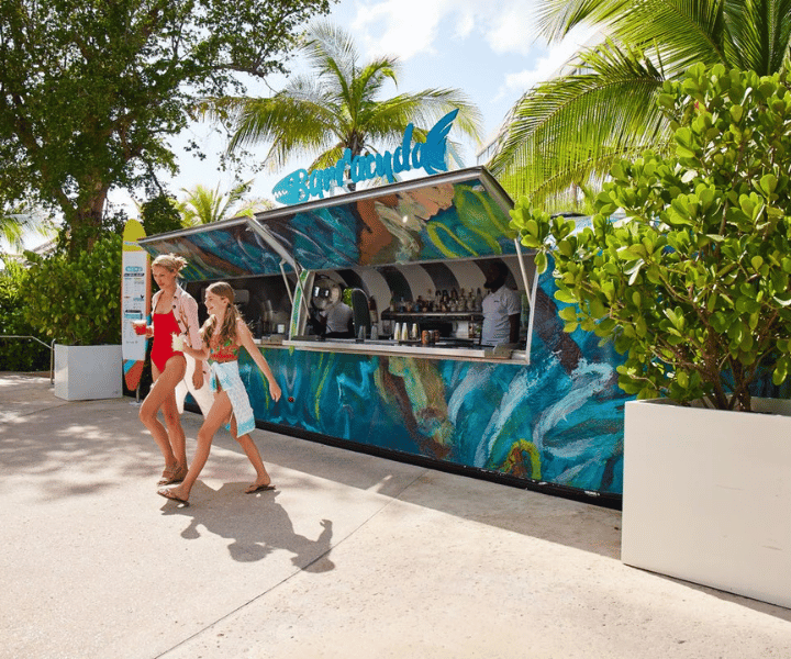 a mom and daughter at barracuda, an outdoor food truck at baha bay