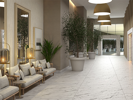 a ballroom foyer with comfortable seating and tall potted plants