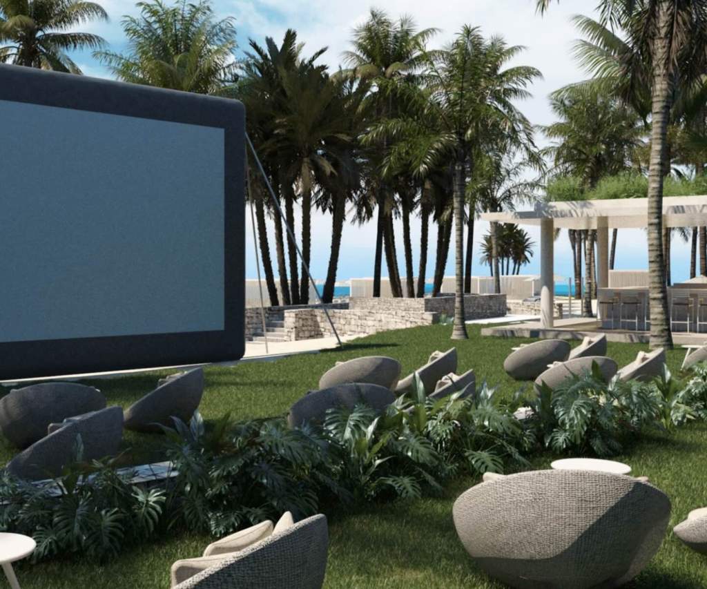 a unique outdoor theater space with seating and a large screen