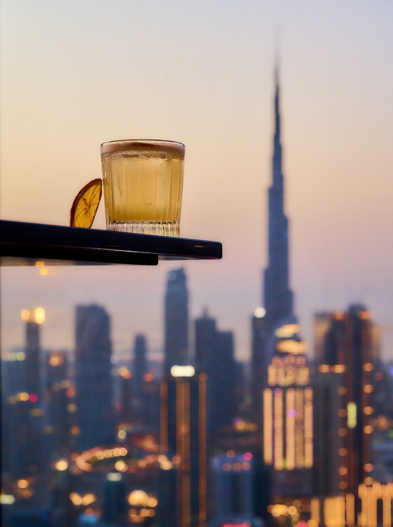 a cocktail perched with views of the burj khalifa