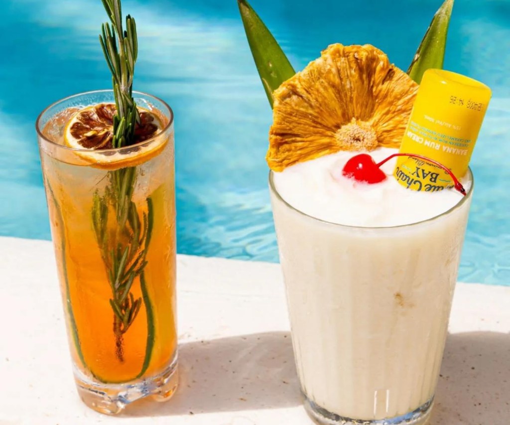 Botanic Spritz and Banana Colada sit poolside at Altitude Pool & Lounge