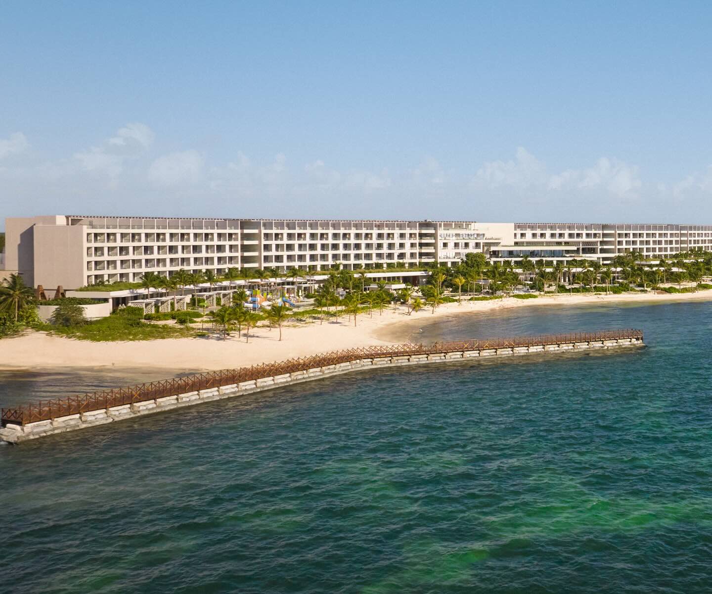 an aerial view of sls playa mujeres and the beach in front of the hotel