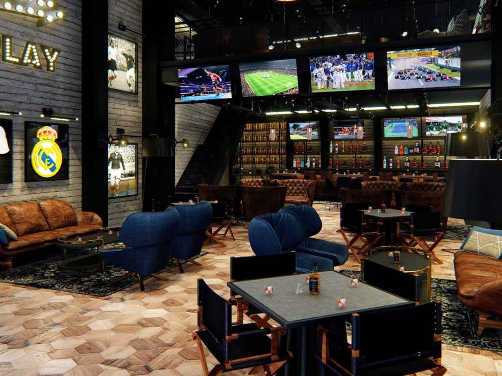 a sports bar decorated with comfortable seating, ample tvs and and sports themed decorations