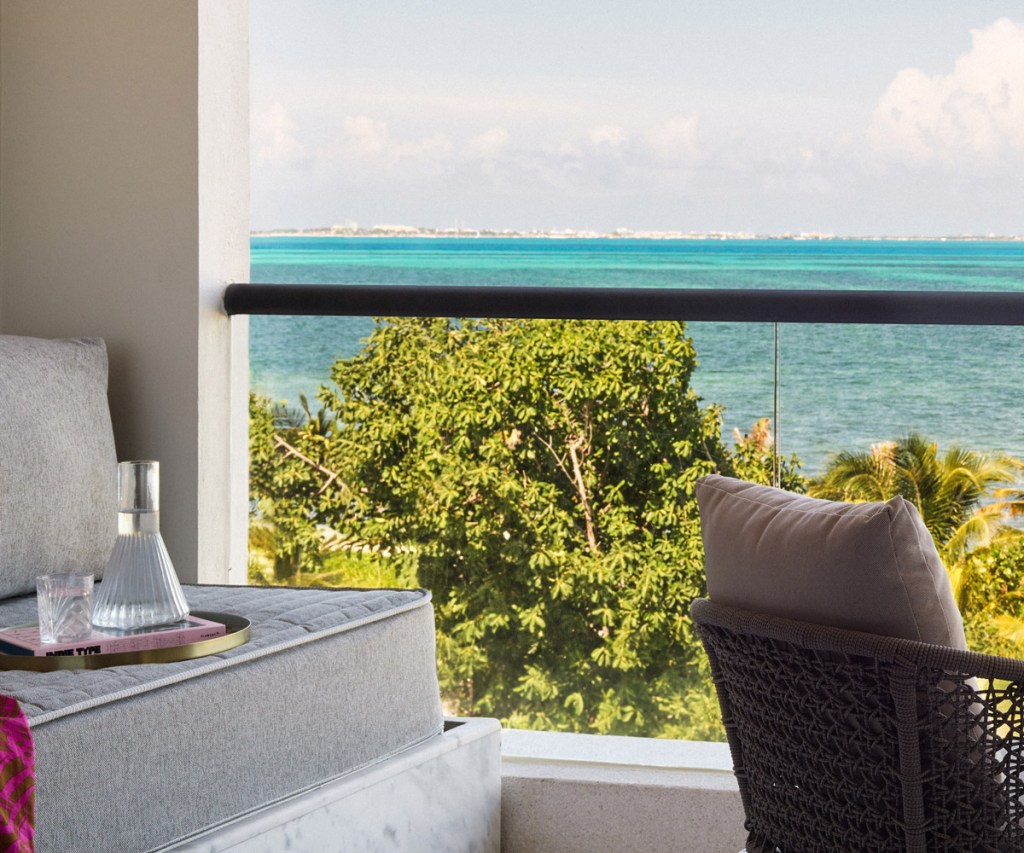 a plush seating area on the patio with views of the ocean