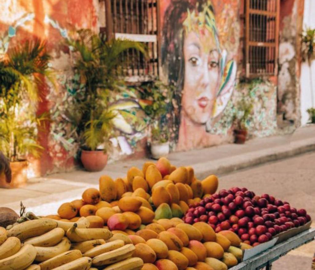 a pile of fruit at a street vendor
