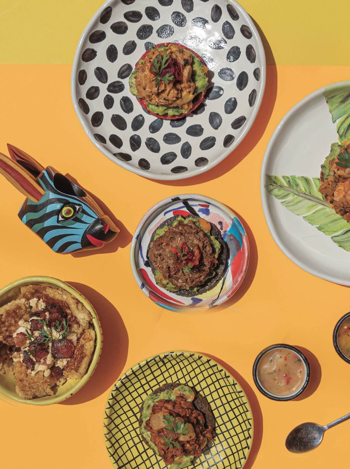 a collection of food plates on an orange table