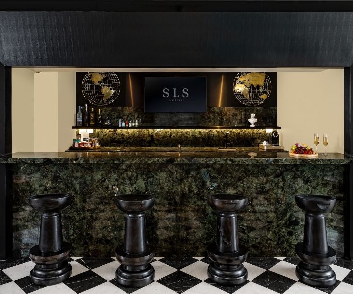 The SLS South Beach Tower Penthouse bar space sits with gorgeous green marble and amenities