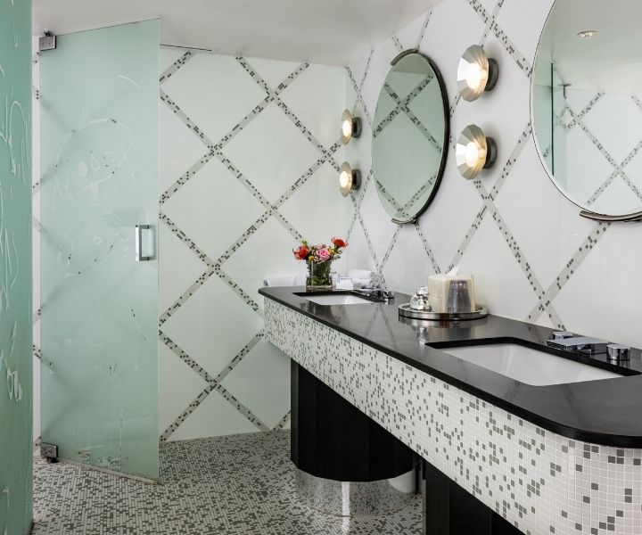 Villa Penthouse bathroom sits with fresh flowers looking dazzling for its next visitor