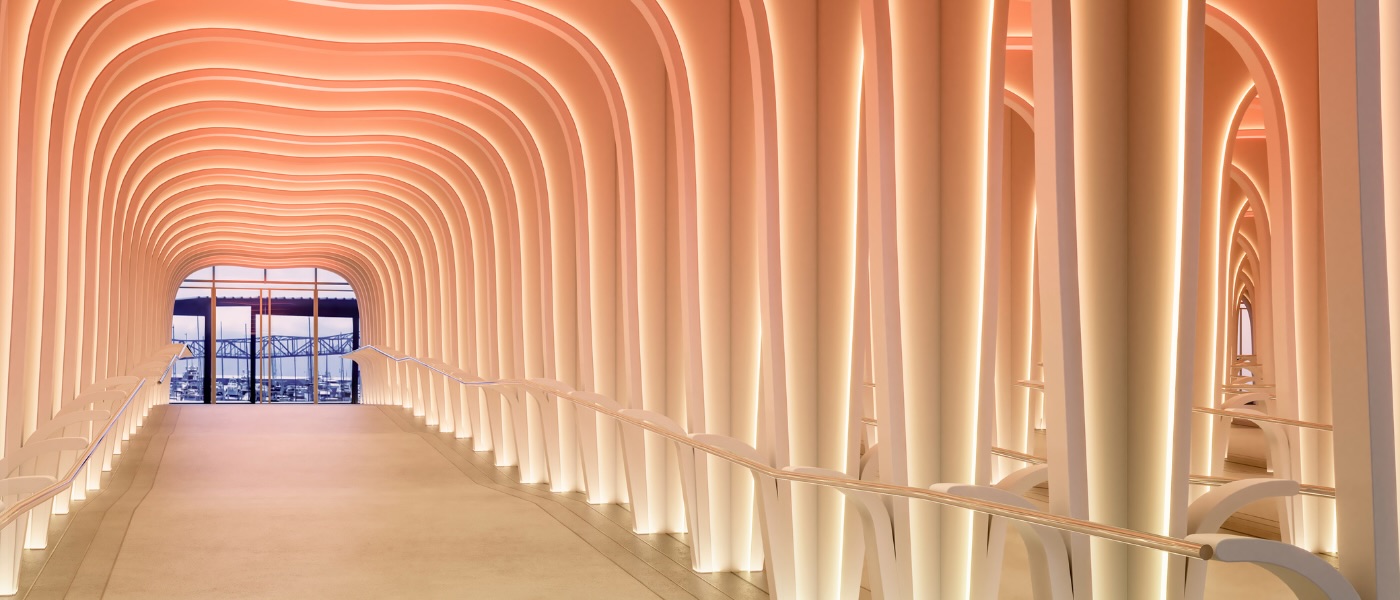 a lighted ramp entrance at sls barcelona connecting the lobby to the entrance