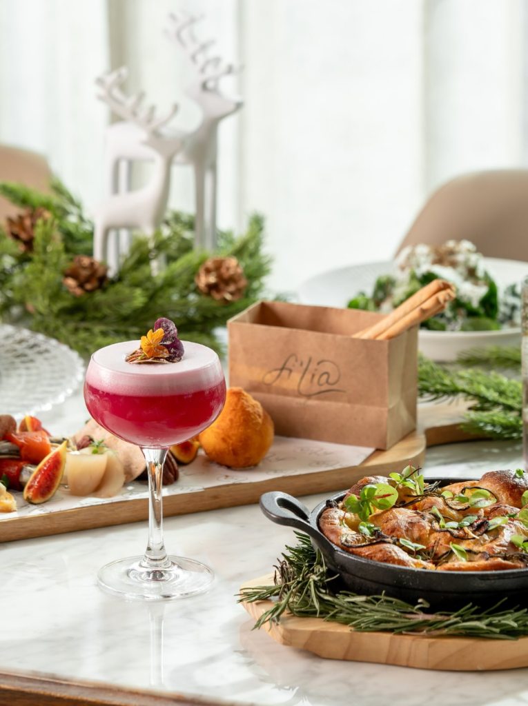 festive dishes and cocktails on a large table with festive decorations