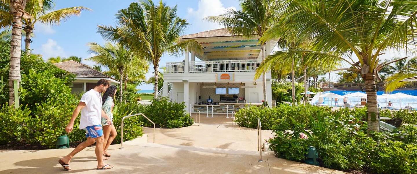 two guests walking into umami burger at baha bay