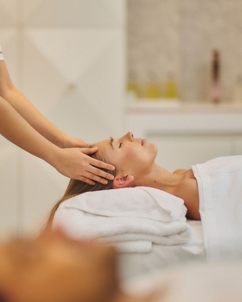 A woman enjoys a relaxing massage in a serene spa setting