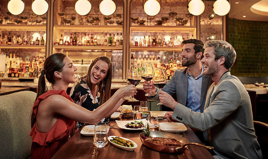 A group of people enjoying dinner at the esteemed restaurant Carna.