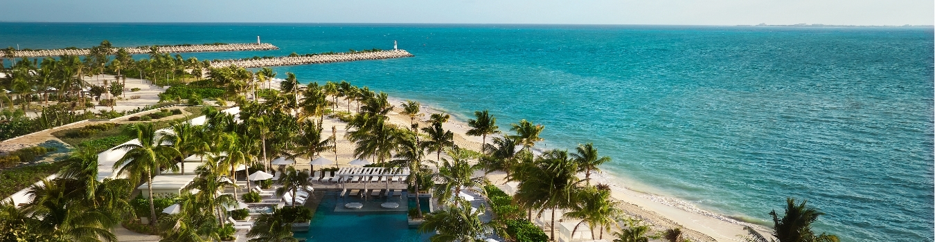 an aerial view of the beach and one of four pools at SLS playa mujeres