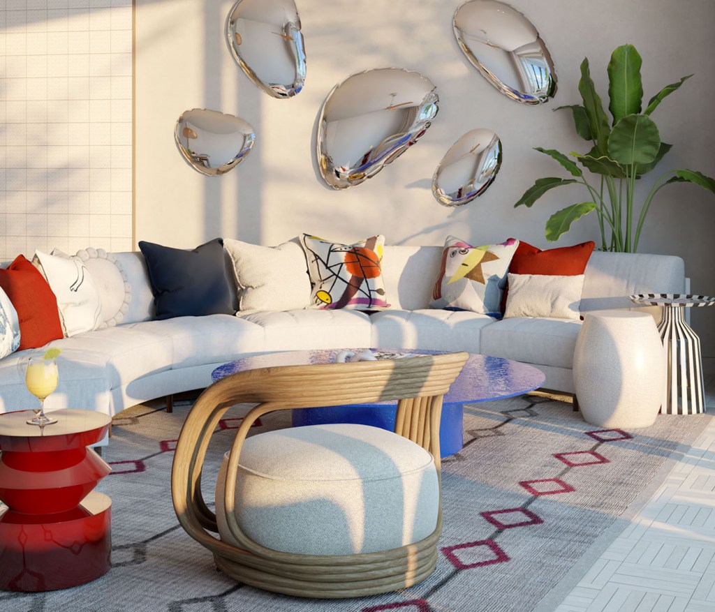 A light filled living space with a white sofa and accent cushions.