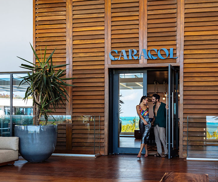 a couple leaving Caracol restaurant at SLS Playa Mujeres