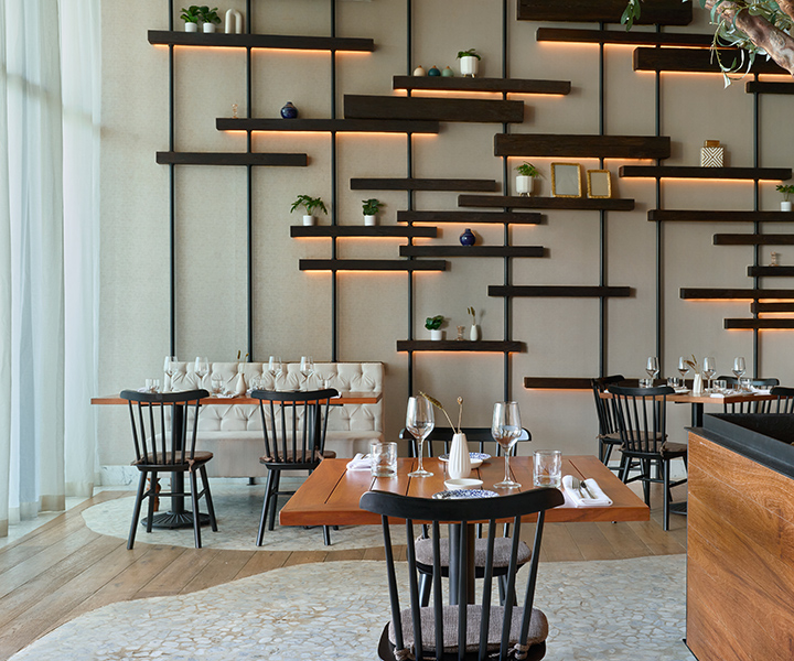 elegant interiors of Fi'lia restaurant at SLS Playa Mujeres, set for service