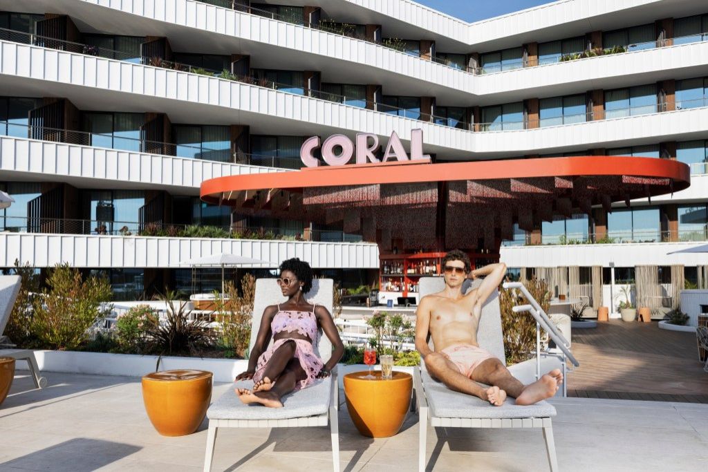 image of a man and woman in lounge chairs at coral restaurant