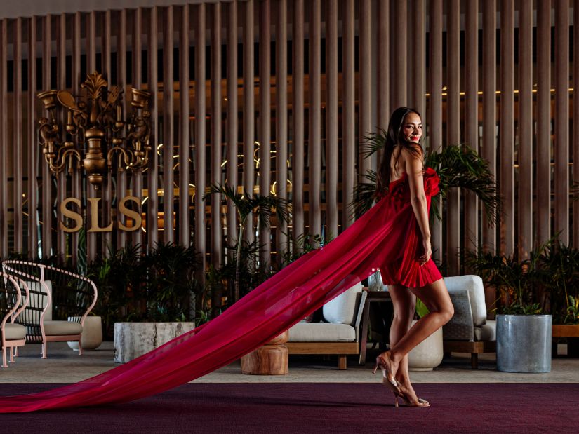woman in a red dress in a hotel lobby