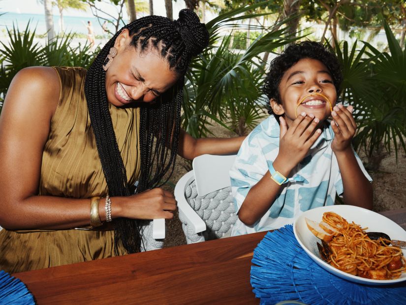 mother and son dining beachside at sls playa mujeres