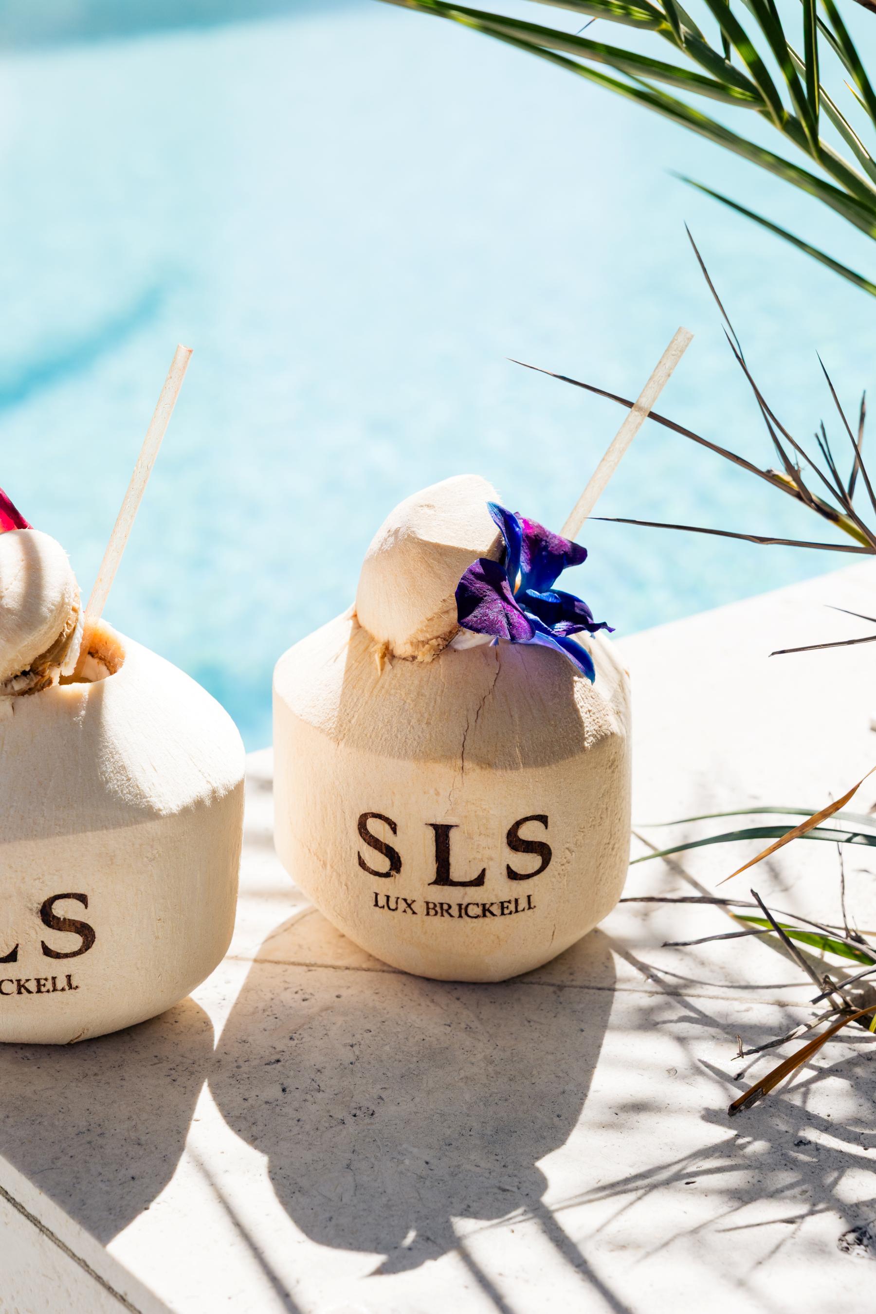 cocktails in branded SLS coconuts by the pool 